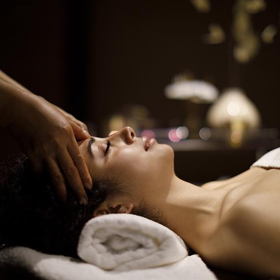 Woman receiving head massage